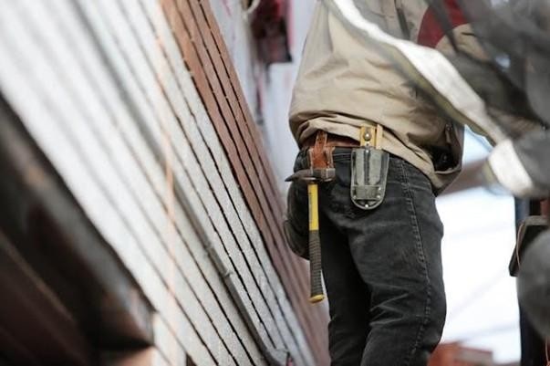 Technician fixing something on the roof